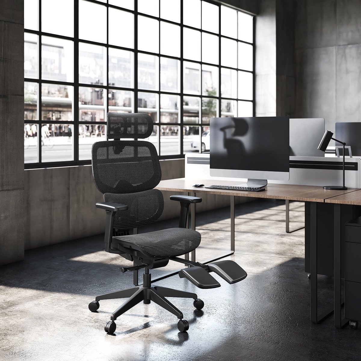 Black FlexiSpot C7 with a mesh seat and extended footrest beside a desk.