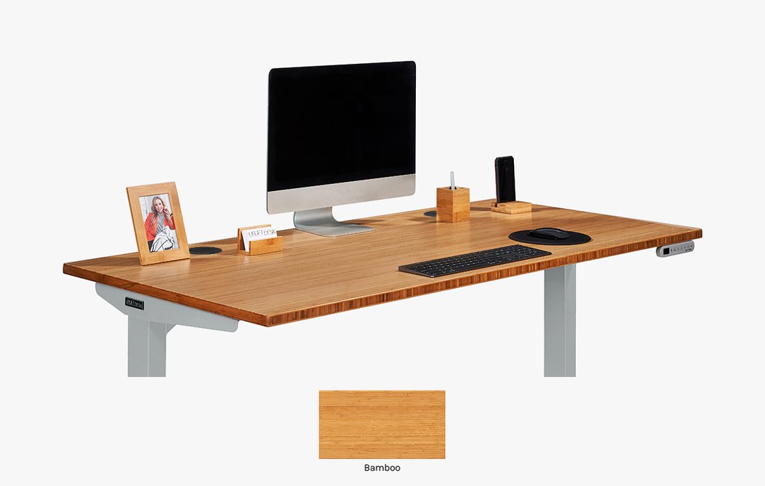 Legacy UPLIFT V2, gray frame with bamboo desktop, identified by the official source. This is distinct from the V3 cover above.