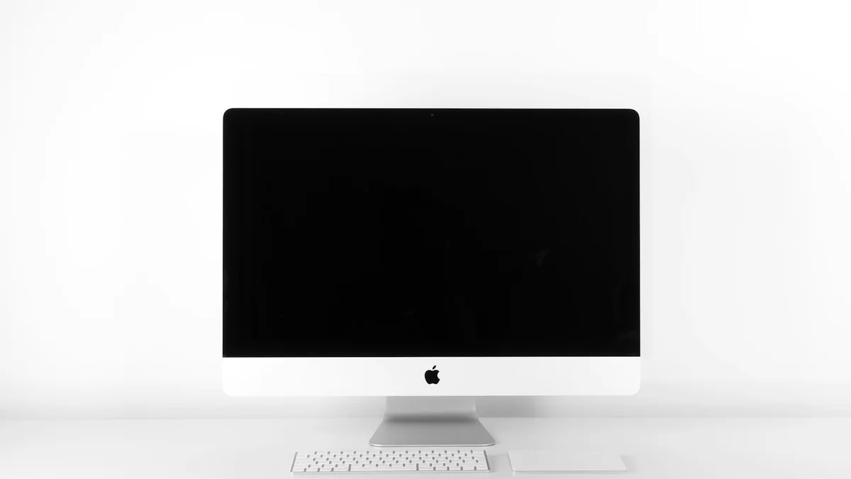 Dell UltraSharp U4025QW 40-inch curved 5K2K monitor on clean workspace